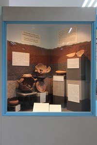 Figure 8. Exhibit case featuring stratigraphy, ceramic seriation, and changes in burial practices over time